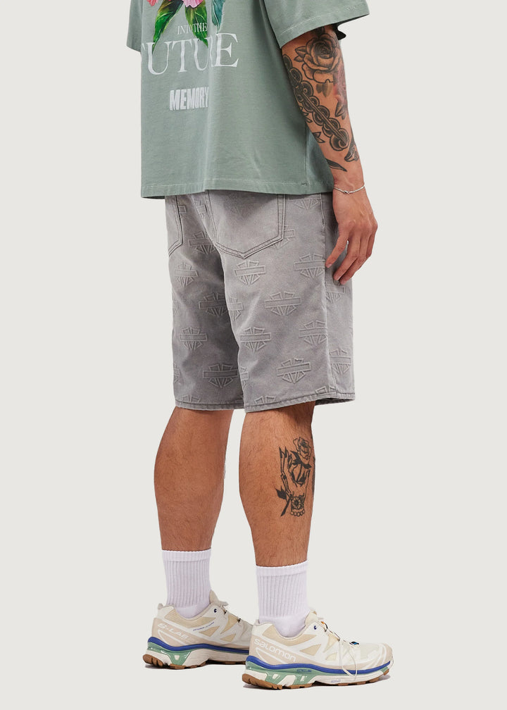 M SHIELD DEBOSSED PATTERN SHORTS