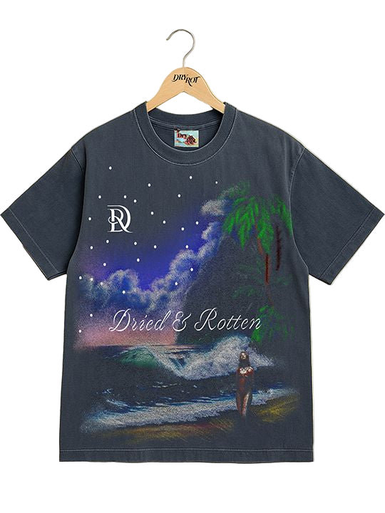 T-shirt with artistic design of a person on a beach under a starry sky